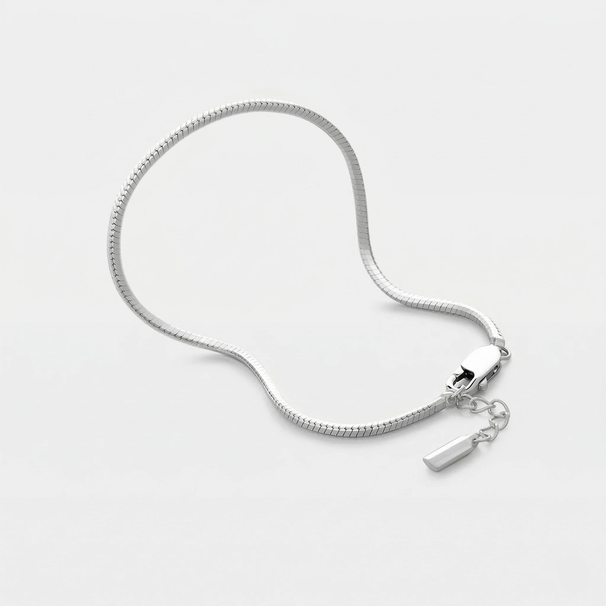 Silver octagonal bracelet on a light gray background