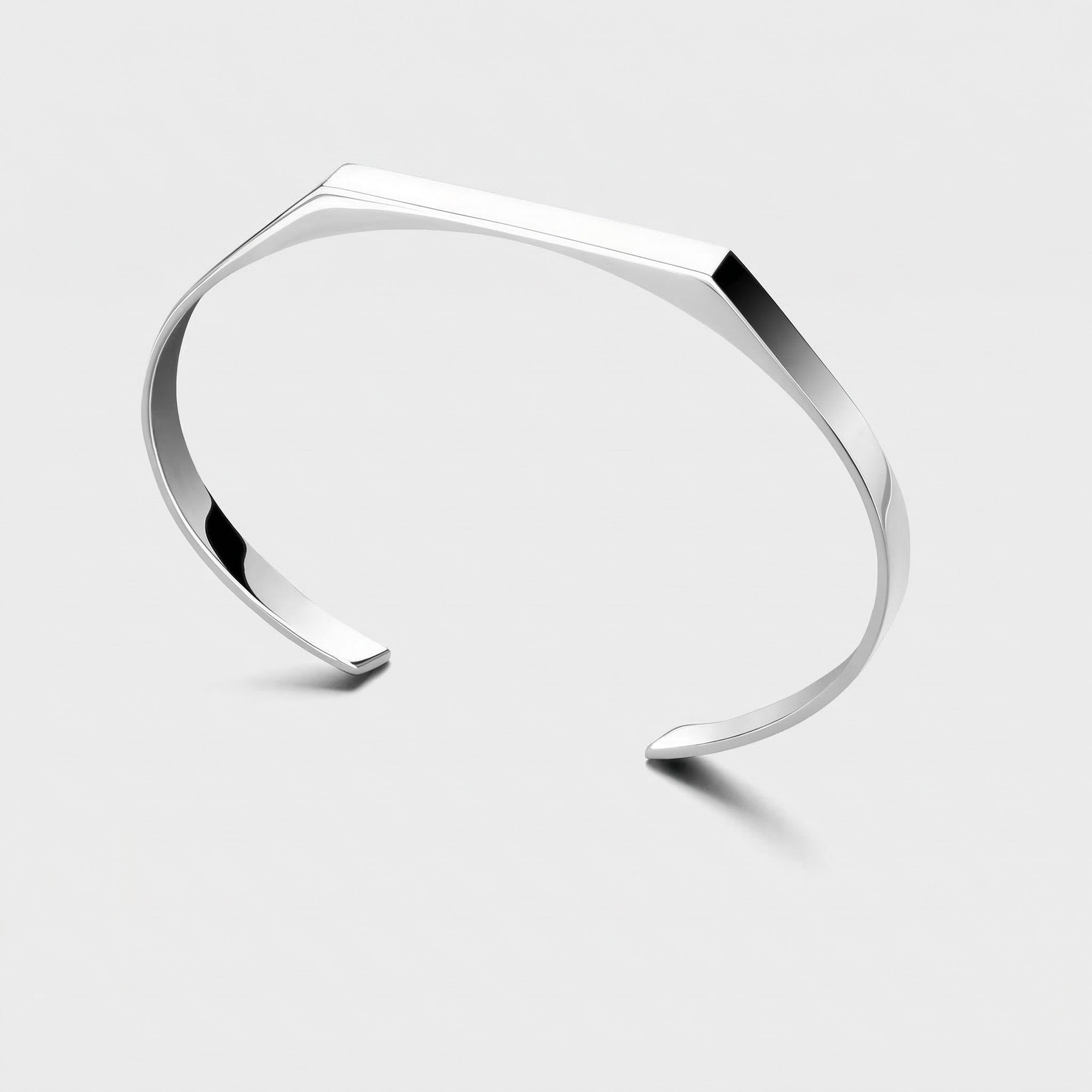 Silver rectangle cuff bracelet on a light gray background