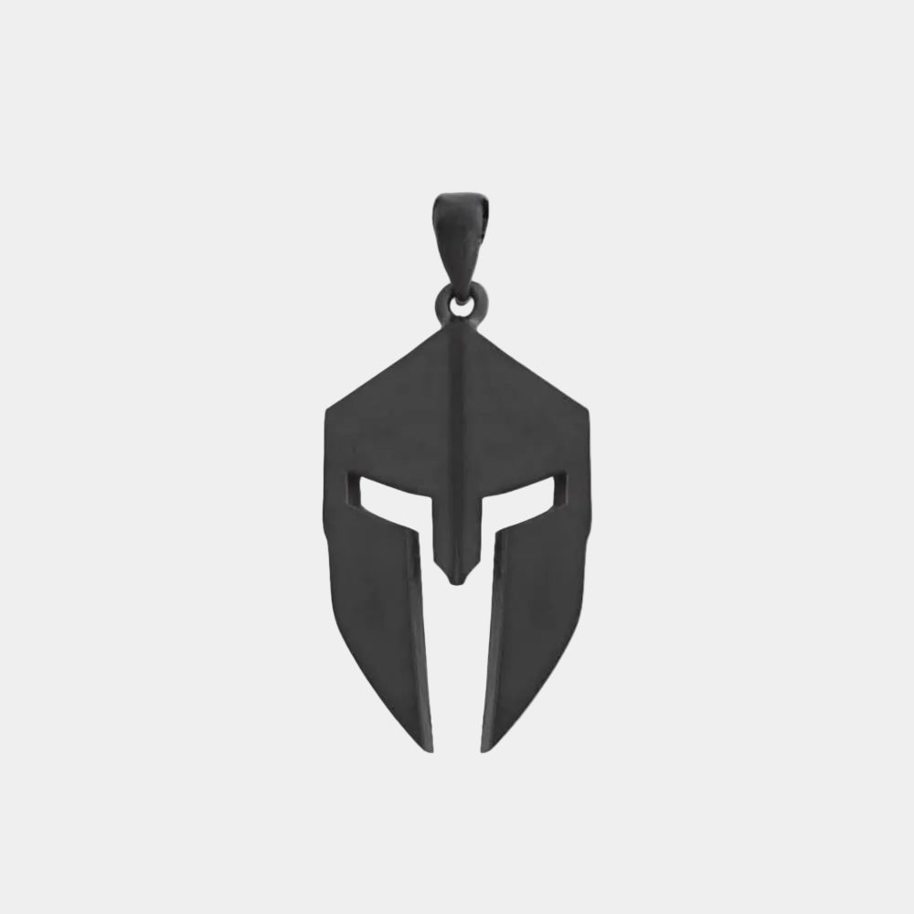 A matte black necklace pendant in the shape of a Spartan helmet