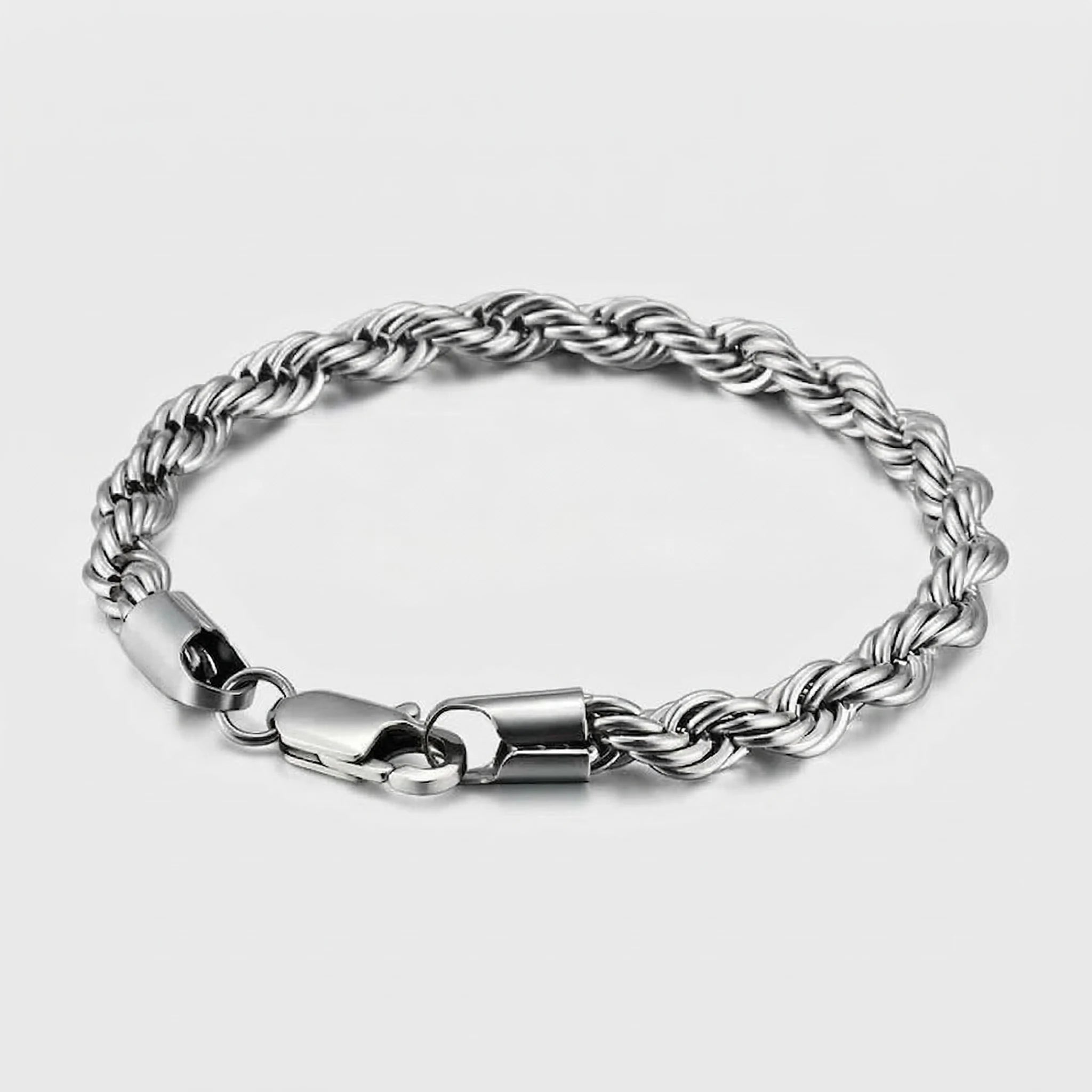 Silver twist chain bracelet on a light gray background